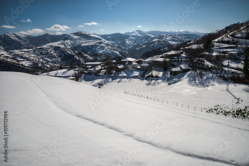 Snowy village in the courel range photo