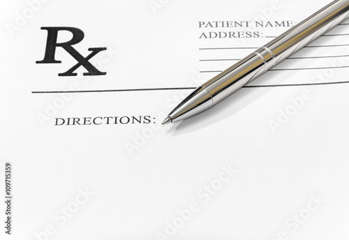 prescription form with pen
