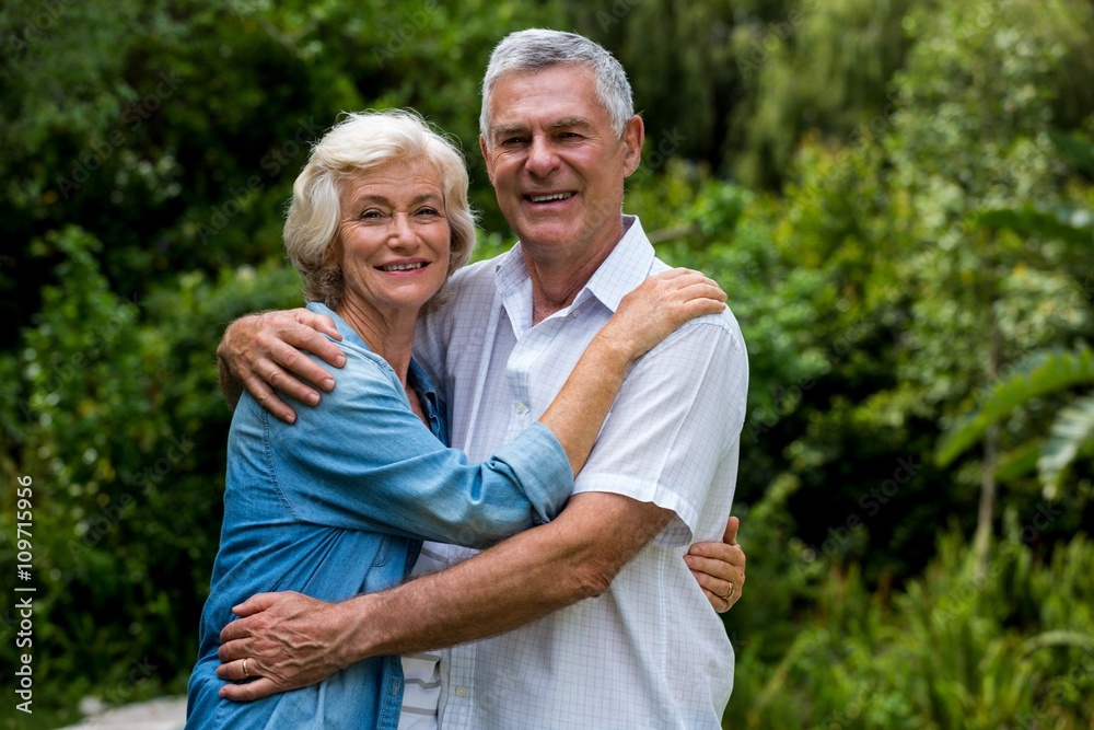 Portrait of loving senior couple in back yard Portrait of loving senior couple in back yard