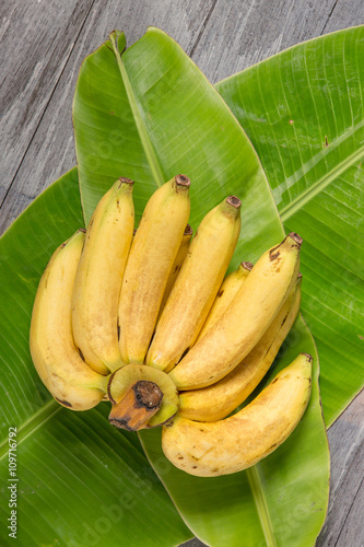 Fresh bananas on wooden background