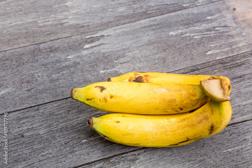 Fresh bananas on wooden background