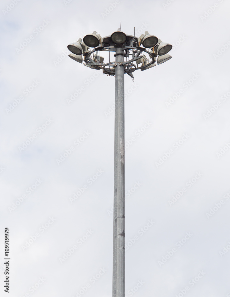 a large pillar with lights against the sky