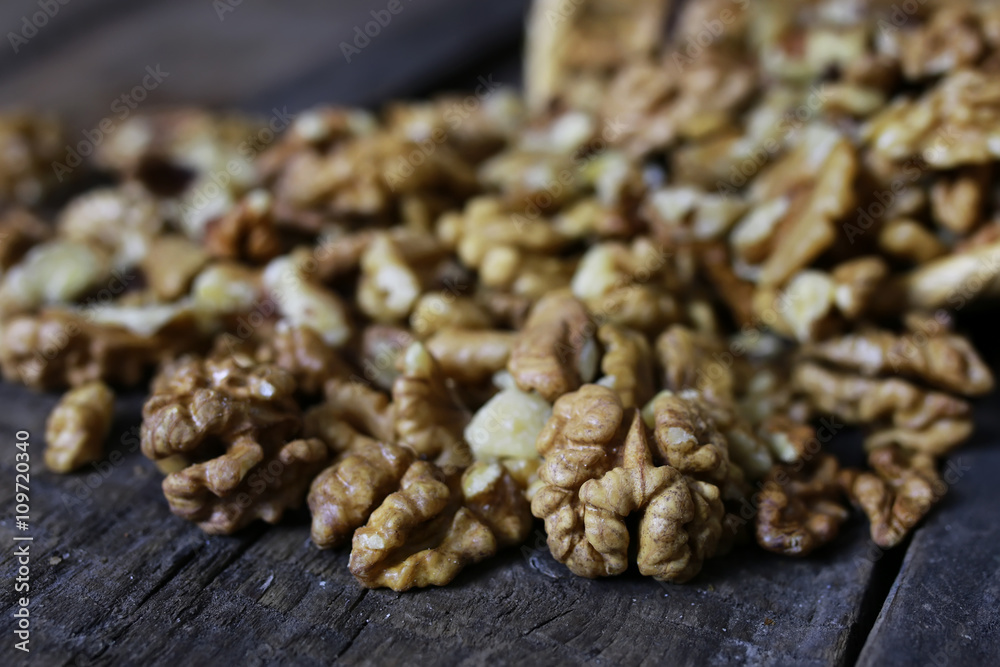 peeled walnut on a wooden background peeled walnut on a wooden background