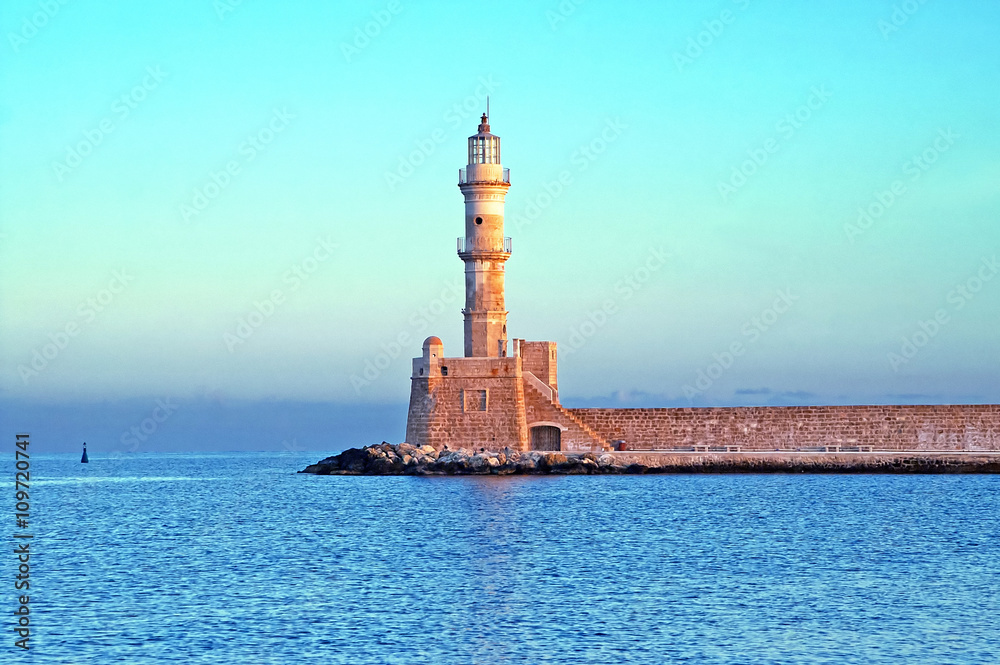 Old venetian lighthouse of Chania in Crete, Greece on the sunrise