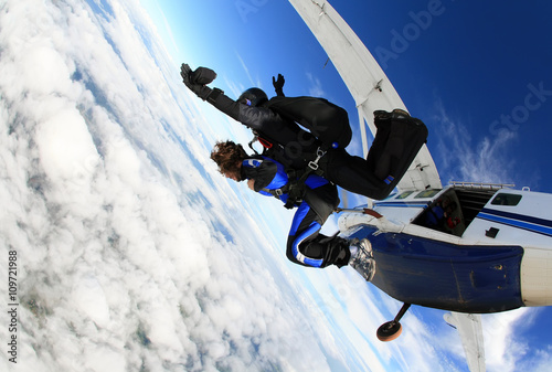 Skydiving tandem jumping from the plane photo