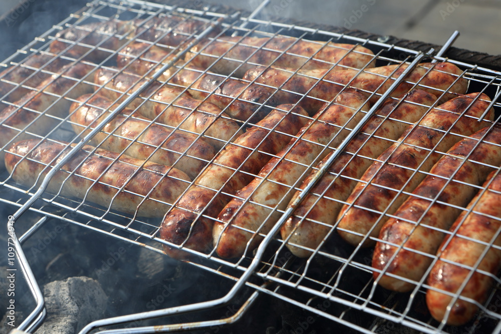 Cooking of sausages on the grill