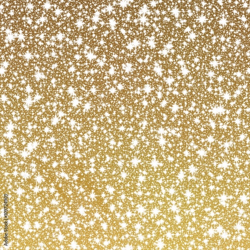 Gold shining background with glittering stars or falling snow, festive luxurious pattern