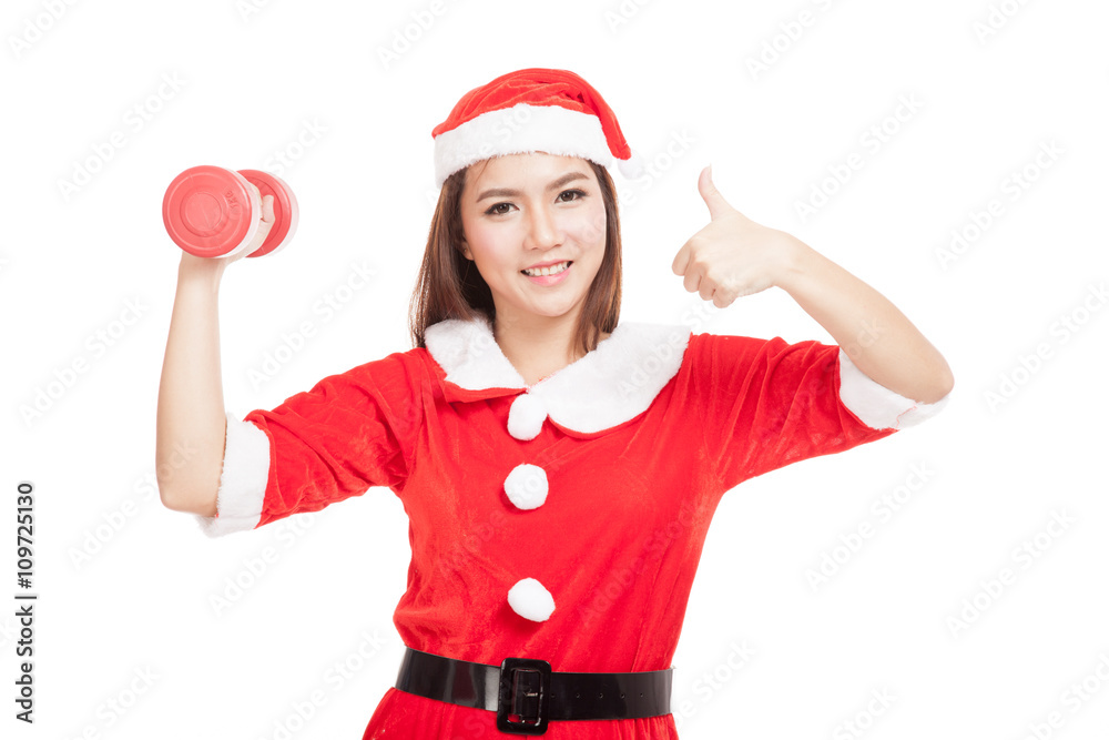 Asian Christmas girl thumbs up with Santa Claus clothes and red Asian Christmas girl thumbs up with Santa Claus clothes and red