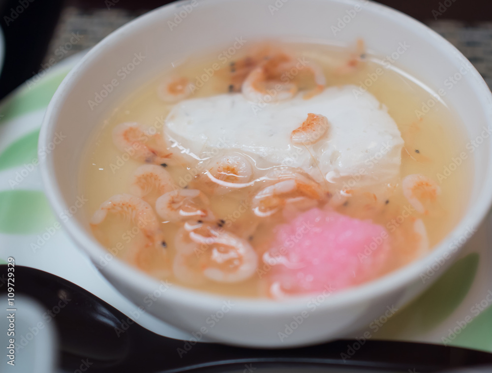 Japanese tofu soup with shrimp in white bowl - Japanese food Japanese tofu soup with shrimp in white bowl - Japanese food