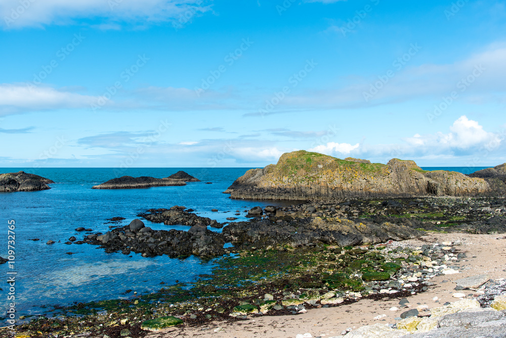 Ballintoy, Antrim, Northern Ireland. The harbour and beach have featured in several episodes of the Game of Thrones.