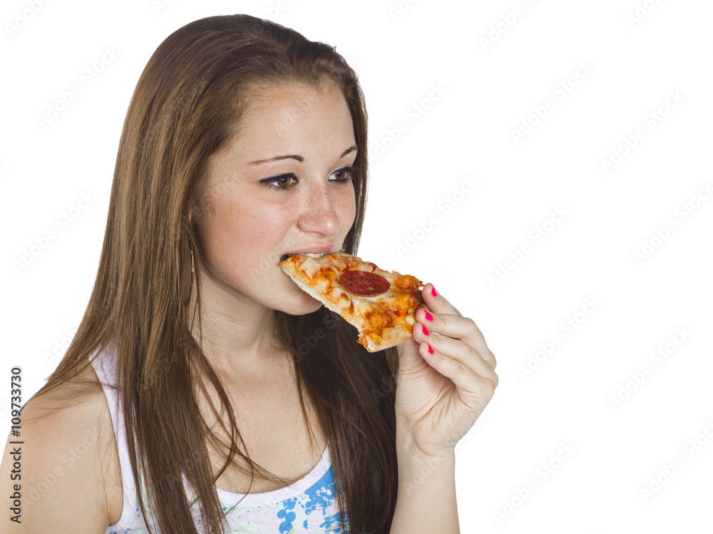teenage girl eating a slice of pizza.