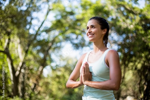 Woman smiling and doing yoga