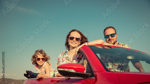 Happy family travel by car in the mountains