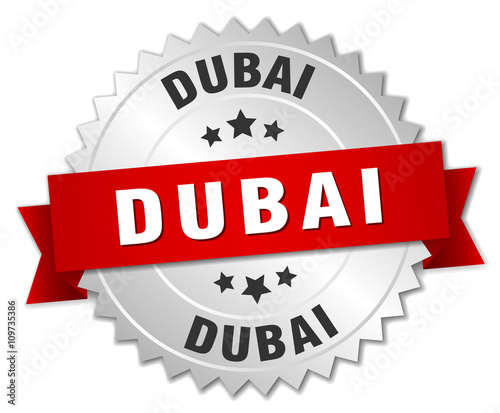 Dubai  round silver badge with red ribbon