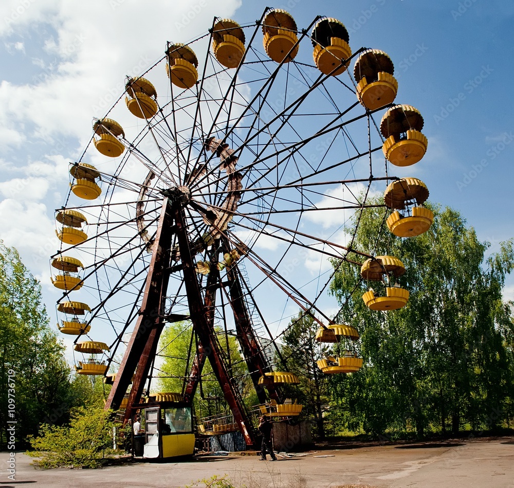 Famous ferris wheel in abandoned amusement park in Pripyat town in Chernobyl Exclusion Zone, place of Chernobyl nuclear disaster in Ukraine