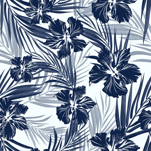 Tropical seamless monochrome blue indigo camouflage background with leaves and flowers photo