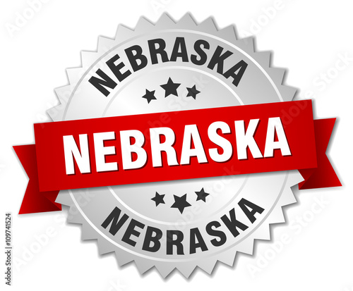 Nebraska round silver badge with red ribbon