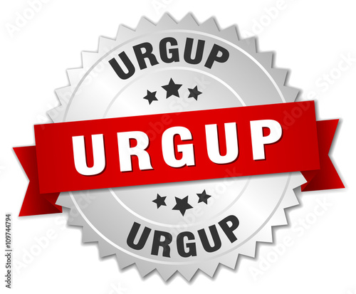 Urgup  round silver badge with red ribbon