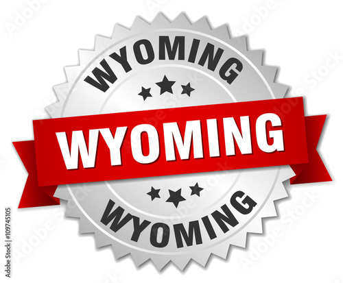 Wyoming  round silver badge with red ribbon