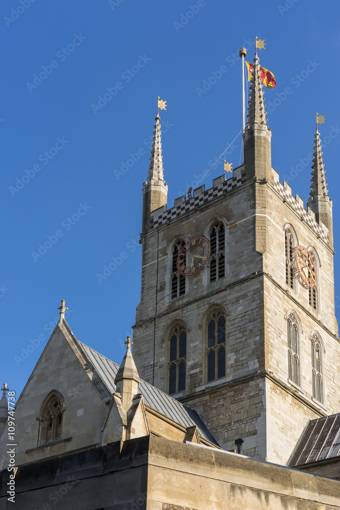 View of Southwark Cathedral tower and clock in London