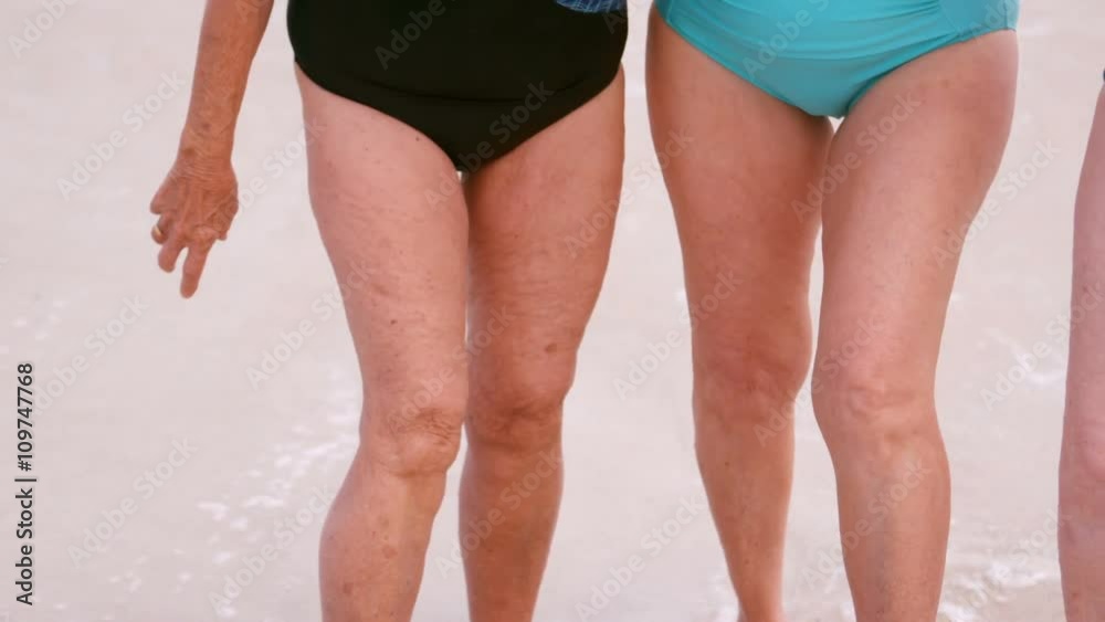 Women mature group are standing behind the sea Women mature group are standing behind the sea