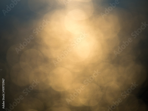 Abstract photo of backlight reflector and glitter bokeh lights background. Image is blurred and made with colorful filters. photo