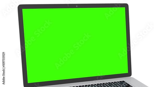 Isolated laptop with green screen on white background. Camera rotating around notebook. Template empty green screen.