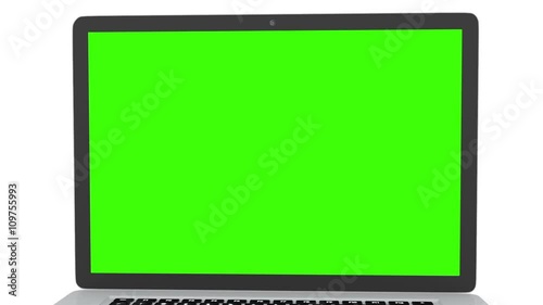 Isolated laptop with green screen on white background. Camera rotating around notebook. Template empty green screen.