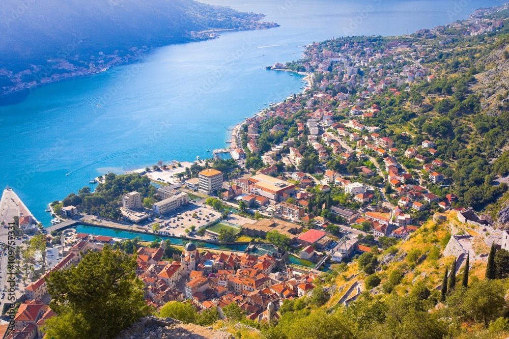  Bay of Kotor in Montenegro with mountains, boats and houses with tile roofs