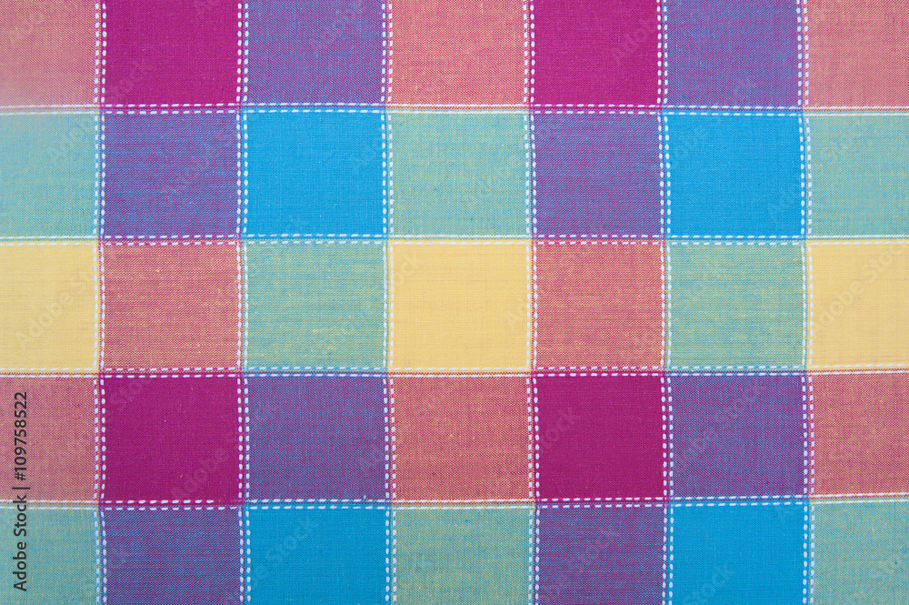 The texture of the textile colored squares of cloth