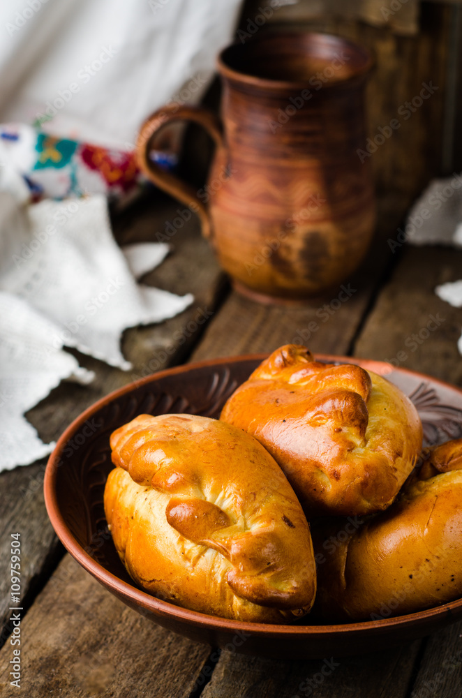 Pies stuffed meat on wooden background, ukrainian or russian cuisine. Selective focus Pies stuffed meat on wooden background, ukrainian or russian cuisine. Selective focus