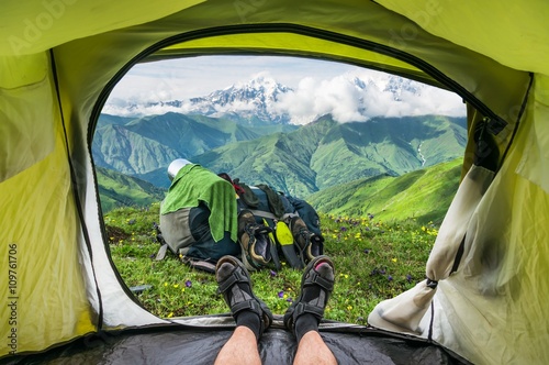 View from inside a tent on the snow-capped mountains