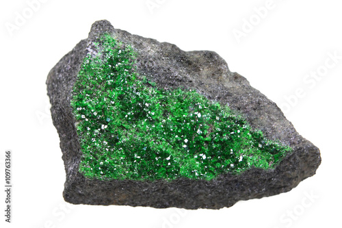 Uvarovite - green garnet isolated on white
