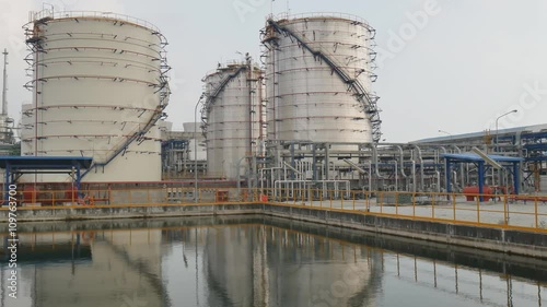 Oil refinery plant to reflection with Fire water pond in refinery plant 