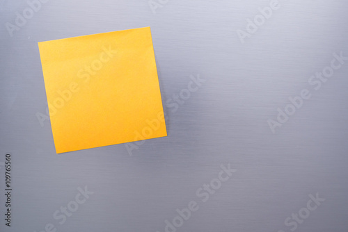 Blank sticky note on The refrigerator (for your text)
