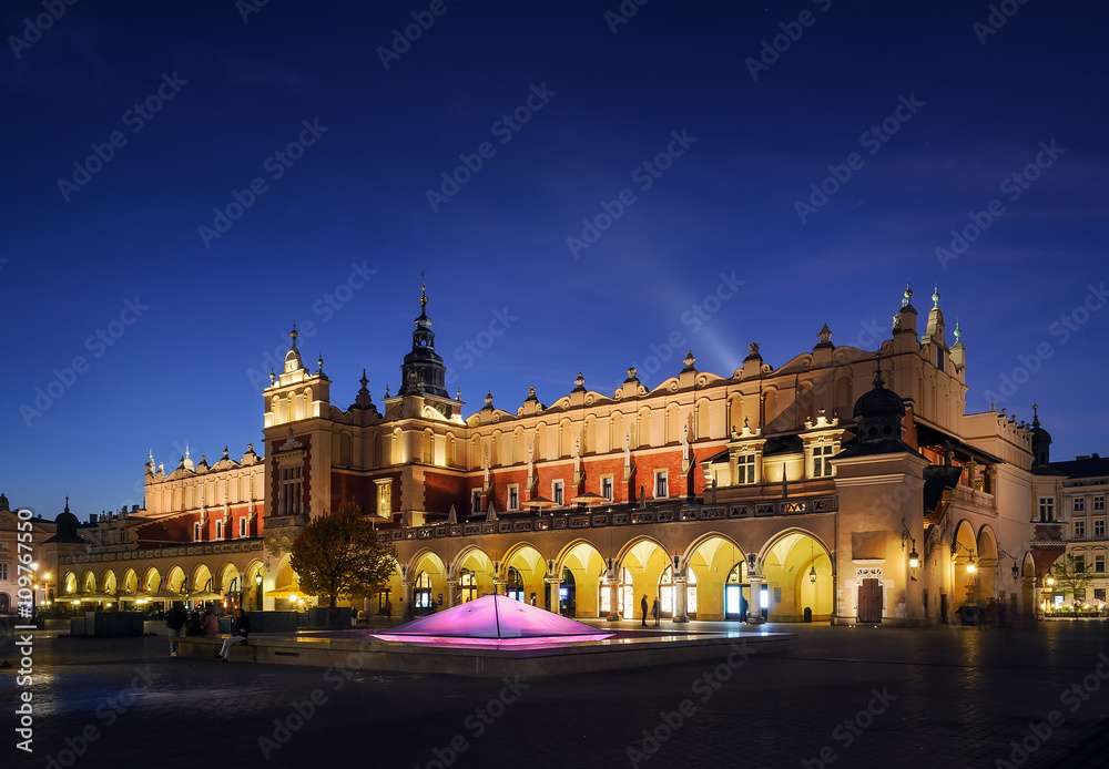 Cloth Hall Sukiennice building after sunset in Krakow city
