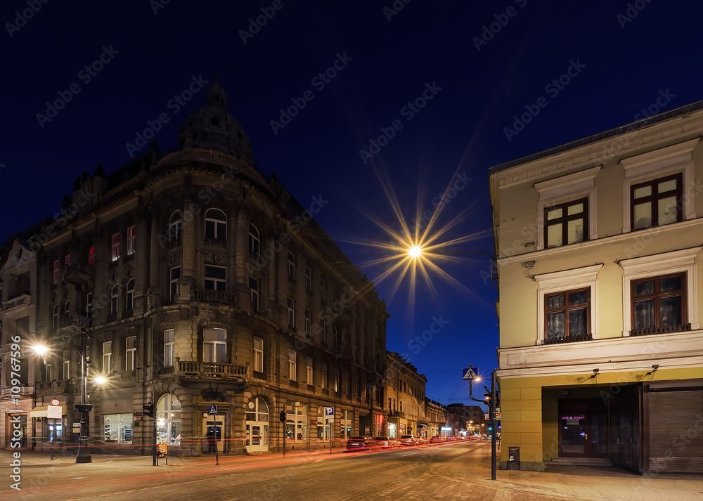 Architecture of Piotrkowska Street after sunset in Lodz, Poland.