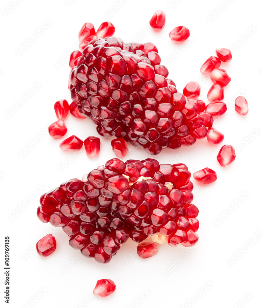 Ripe pomegranate fruit segment isolated on white background cuto Ripe pomegranate fruit segment isolated on white background cuto