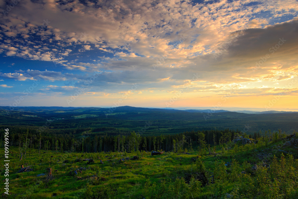 Bountiful morning sunrise in the Sumava Mountain, chop down forest on the hill, nice clouds on the sky, Knizeci Stolec, Czech Republic Bountiful morning sunrise in the Sumava Mountain, chop down forest on the hill, nice clouds on the sky, Knizeci Stolec, Czech Republic