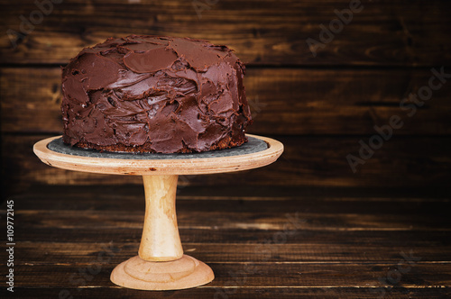Chocolate cake on dark wooden bckground