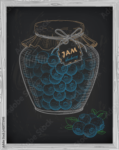 beautiful jar of homemade jam with blueberry on a black backgrou