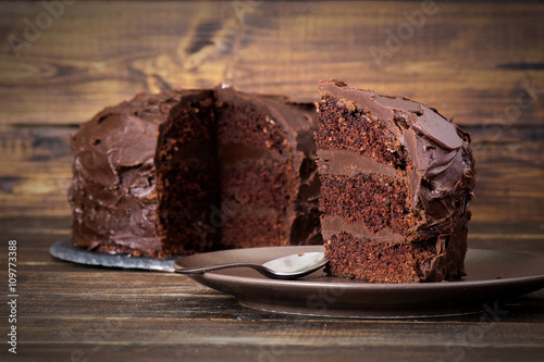 Chocolate cake on dark wooden bckground