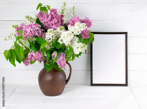 Lilac bouquet in jug with motivational frame © julia_arda