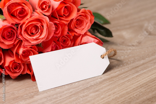 Happy Mother's Day. Greeting card and red rose on wooden backgound. 