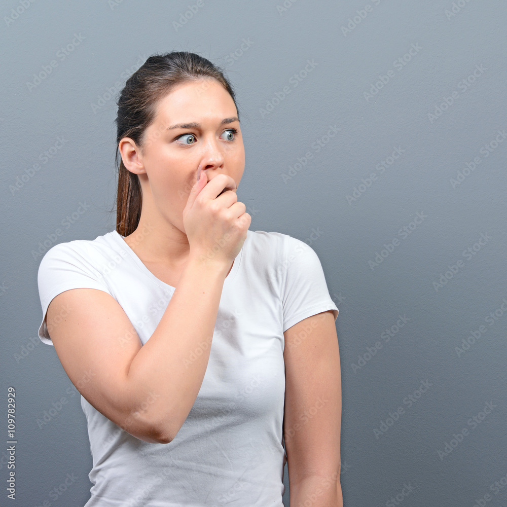 Portrait of a amazed woman against gray background Portrait of a amazed woman against gray background