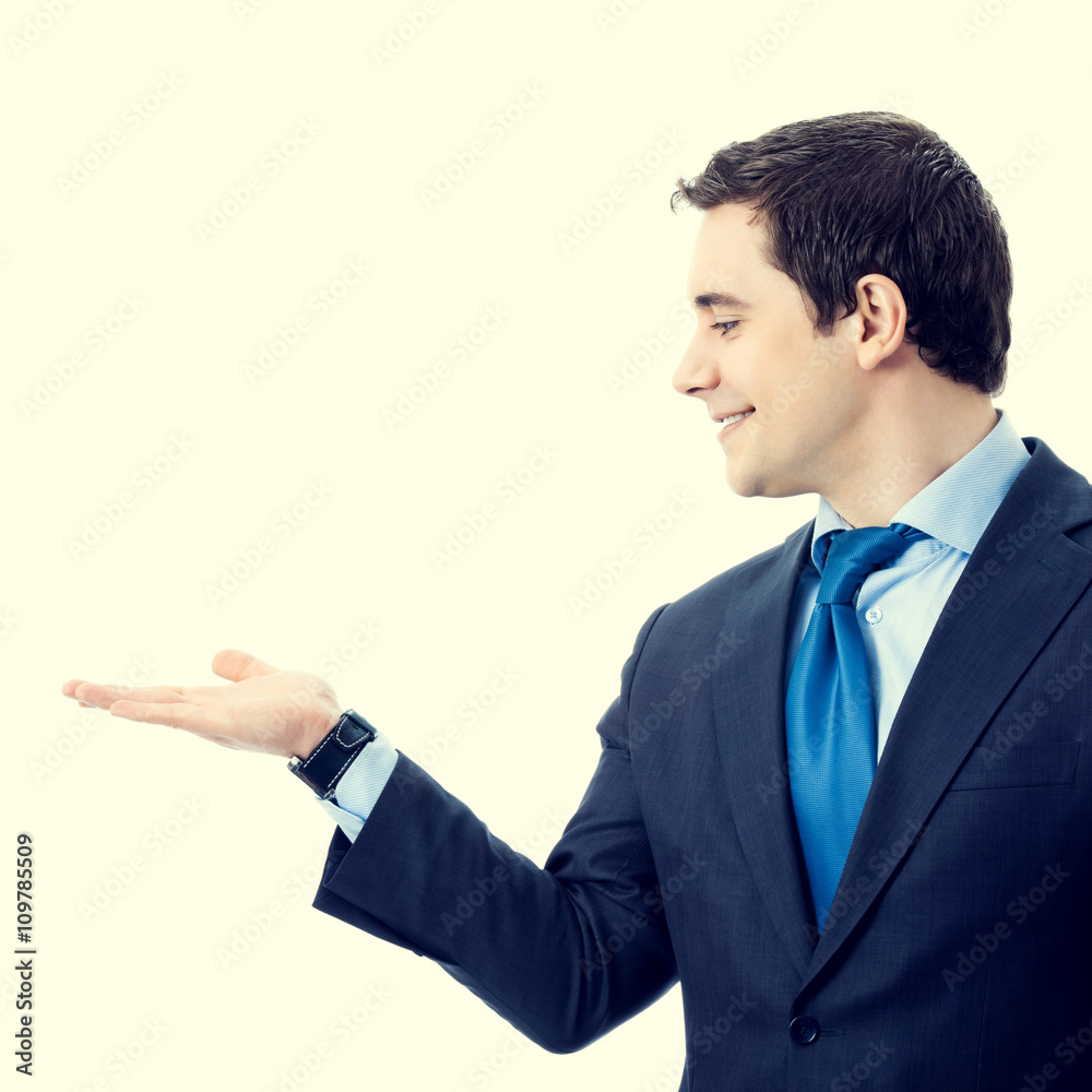 Businessman showing blank area for sign or copyspase Businessman showing blank area for sign or copyspase