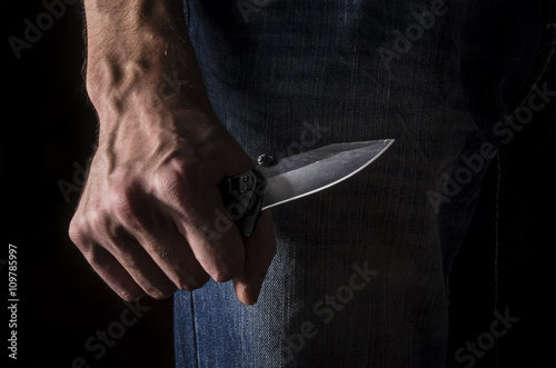 Obraz na płótnie The man with a knife in a hand. Closeup.