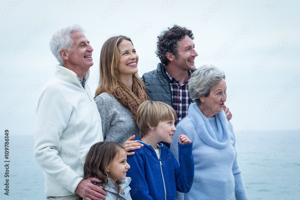 Cheerful family looking away at beach Cheerful family looking away at beach
