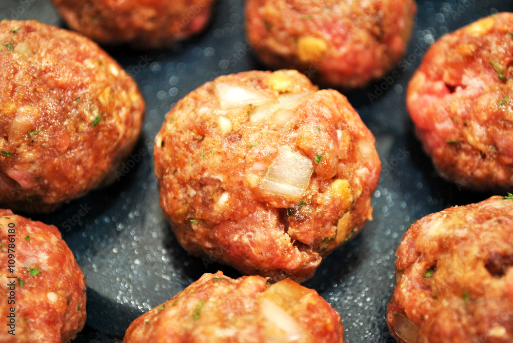 Many Raw Meatballs Ready to be Baked Many Raw Meatballs Ready to be Baked