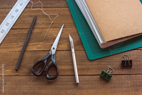 Bilde på lerret Bookbinding tools on wooden table